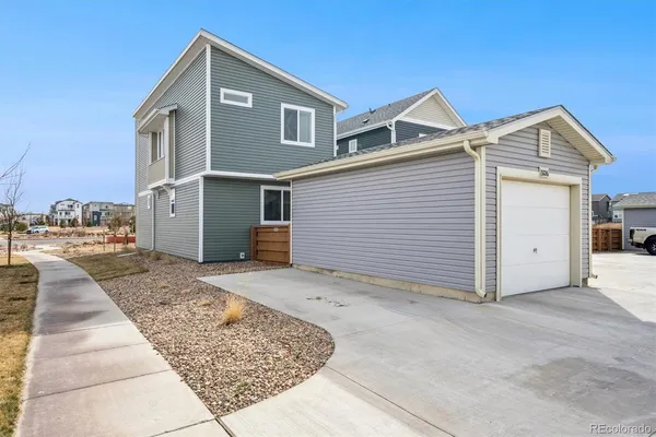 a front view of a house with parking area