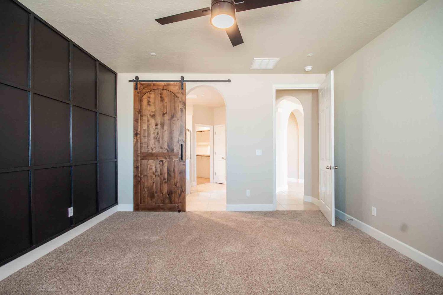 3439 Brimhall Lane Clovis, CA 93619 - Photo 17 of 43 an empty room with closet and a chandelier fan