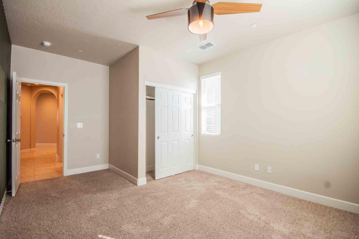3439 Brimhall Lane Clovis, CA 93619 - Photo 30 of 43 an empty room with a empty space and chandelier fan