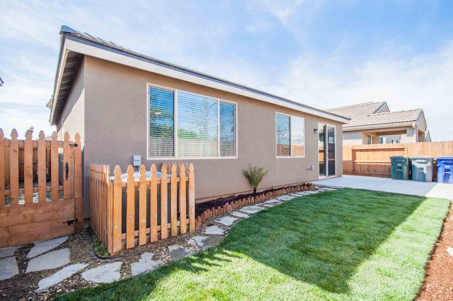 3439 Brimhall Lane Clovis, CA 93619 - Photo 37 of 43 a front view of a house with garden