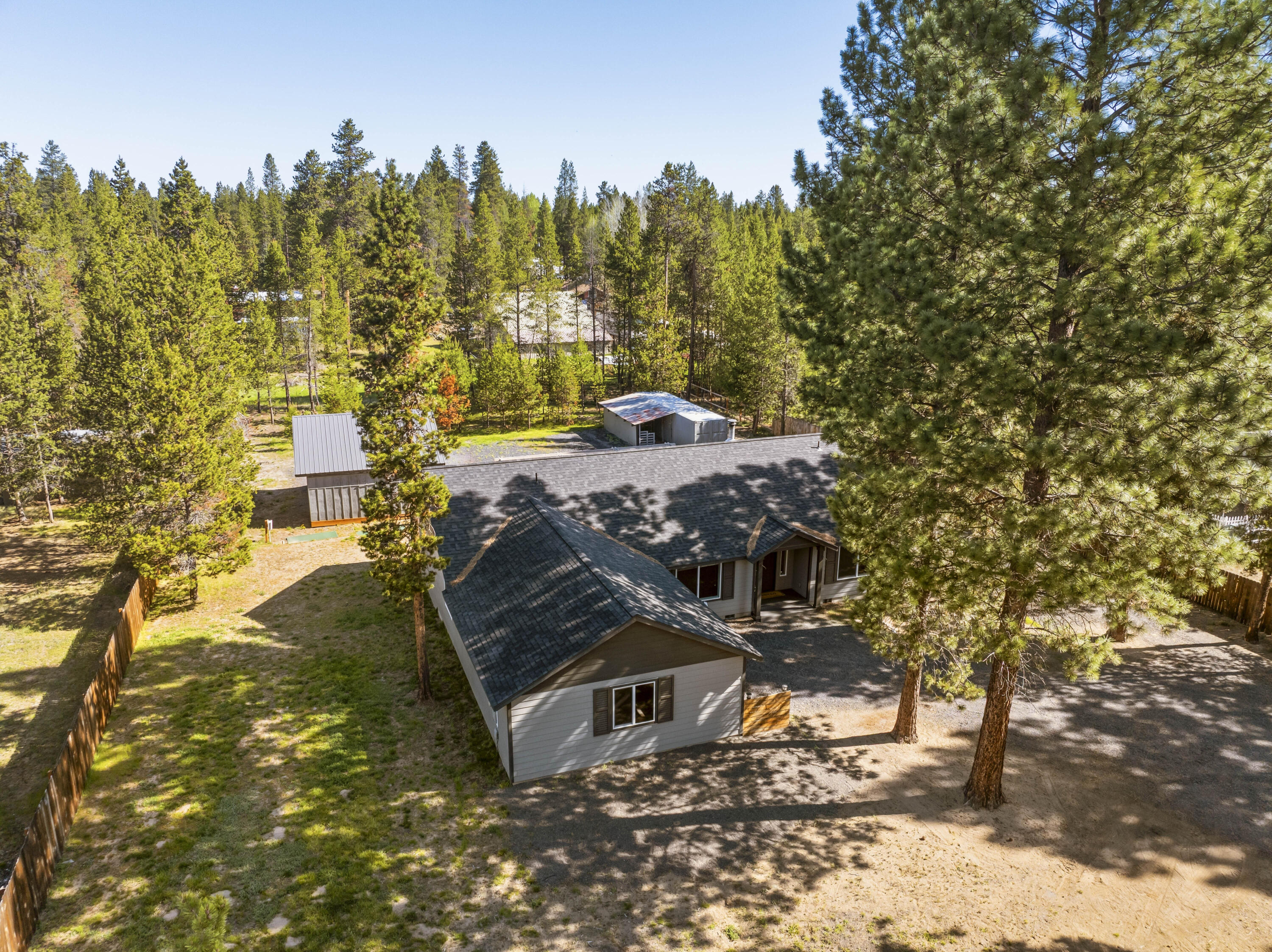 16050 Dick Road La Pine, OR 97739 - Photo 54 of 59 a view of a yard with plants and trees