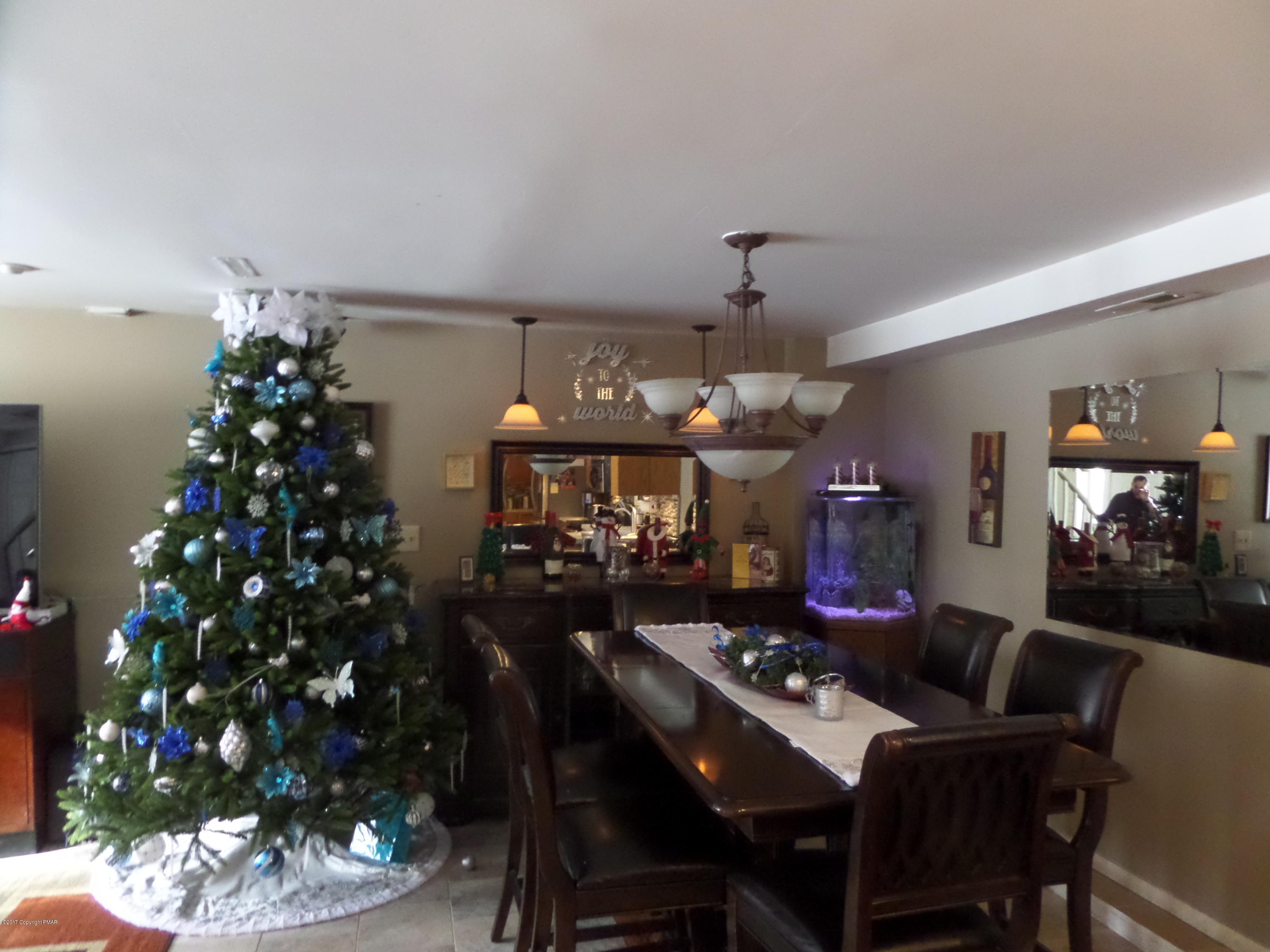 1621 Donalds Road Effort, PA 18330 - Photo 7 of 25 a view of a dining room with furniture and chandelier