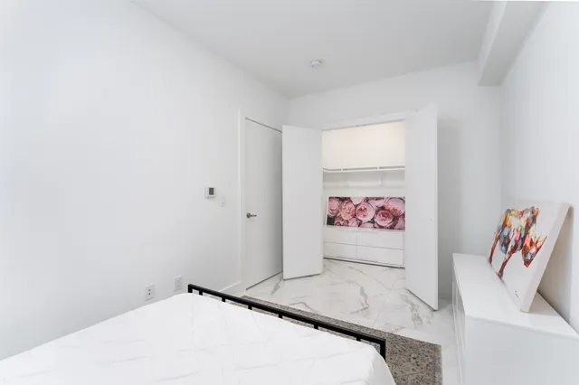 a view of a bedroom with a bed