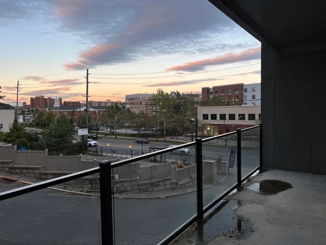 a view of a balcony with chairs