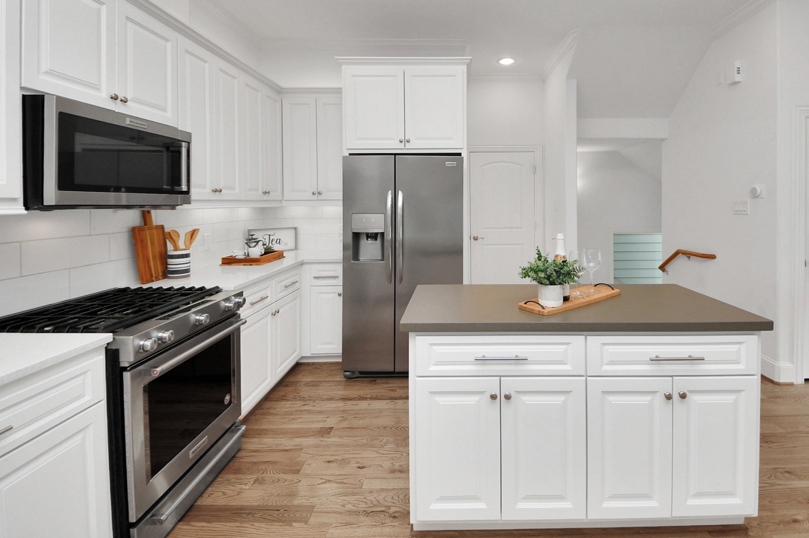 1628 West 24th Street Houston, TX 77008 - Photo 6 of 41 Discover the heart of your home in this spacious kitchen, featuring sleek quartz countertops, modern stainless steel appliances, and a refrigerator that stays!