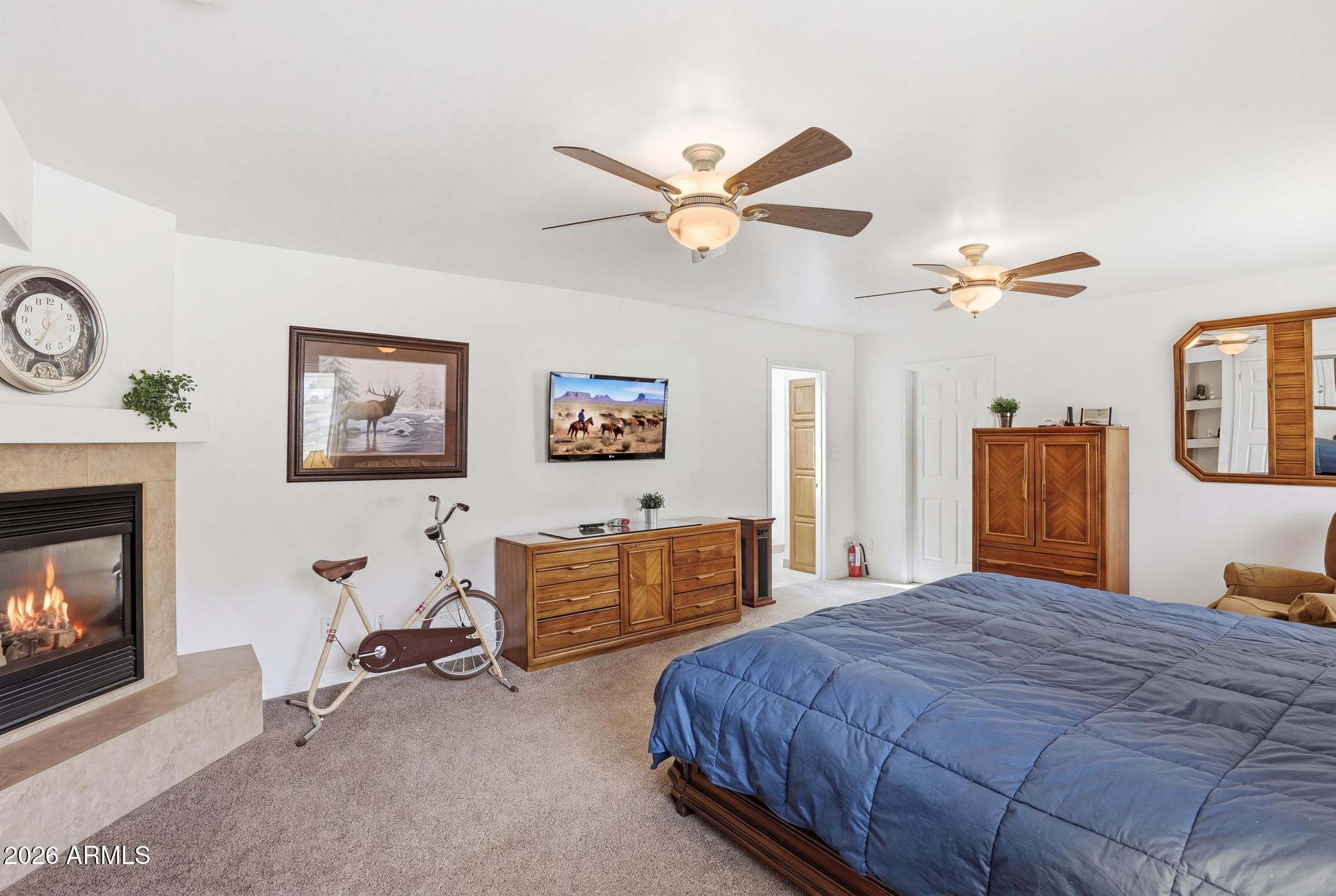 7736 West Gibson Ranch Road Payson, AZ 85541 - Photo 20 of 51 a bedroom with a bed a dresser and chair