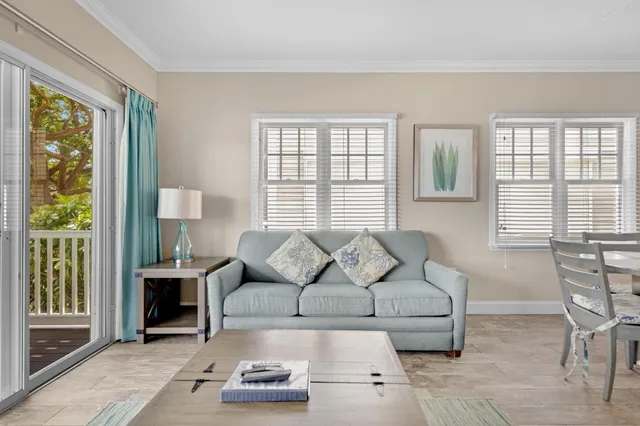 a kitchen with kitchen island a dining table and chairs