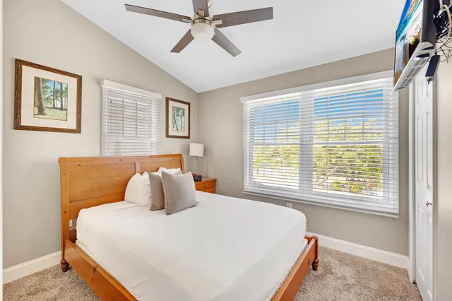 a bedroom with bed and window