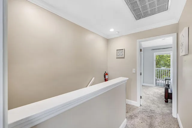 a balcony with wooden floor and outdoor seating