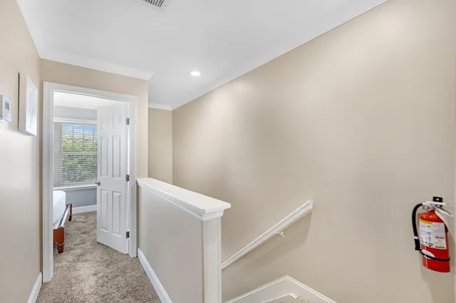 a balcony with wooden floor and outdoor seating