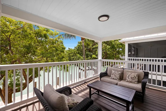 an aerial view of house with yard swimming pool and outdoor seating