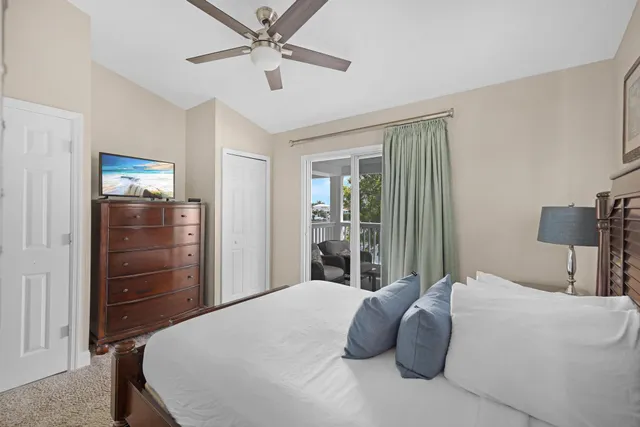 an aerial view of a house with outdoor space and a lake view