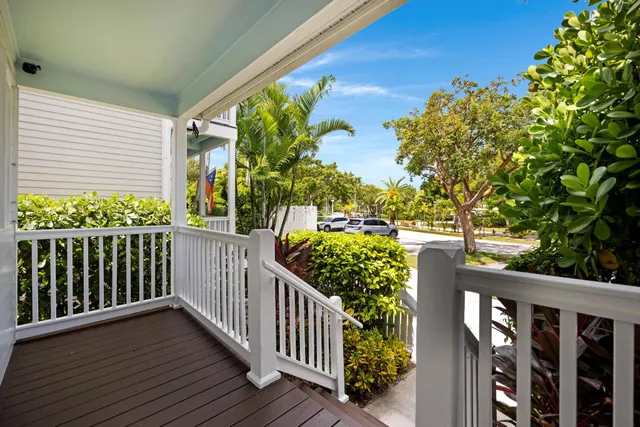 a view of a balcony with wooden floor