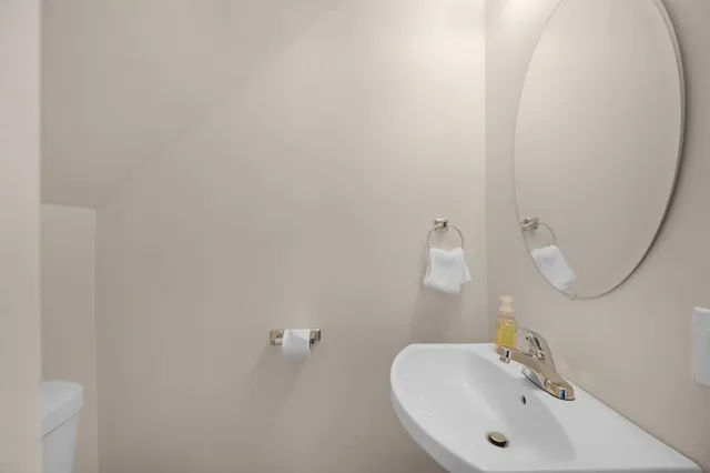 a bathroom with a sink and mirror