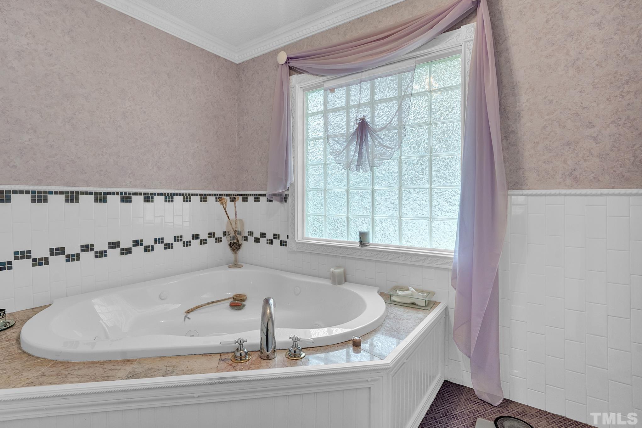 2206 Lyndhurst Drive Raleigh, NC 27610 - Photo 13 of 17 a bathroom with a bathtub and a shower