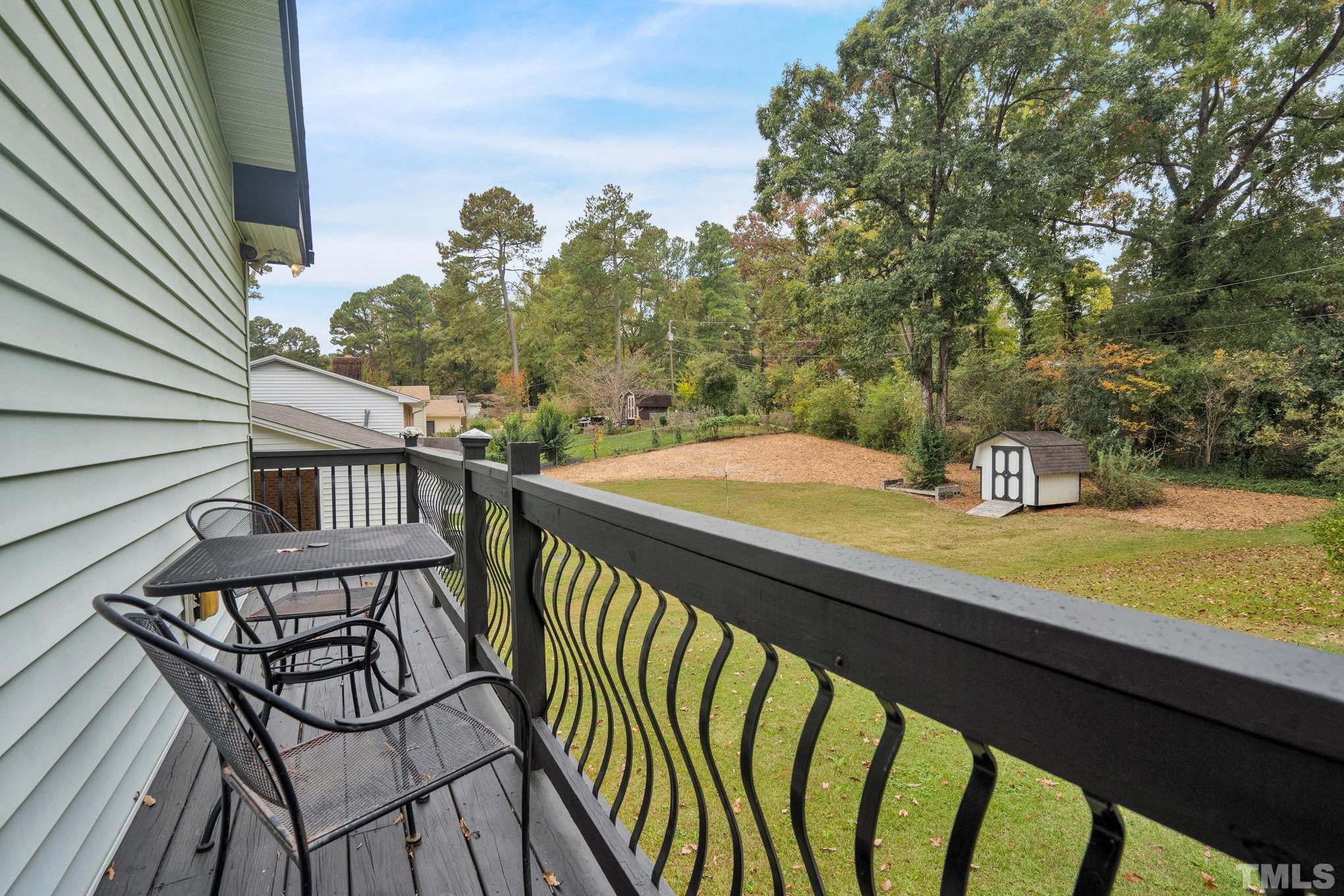 2206 Lyndhurst Drive Raleigh, NC 27610 - Photo 14 of 17 a view of a chairs and table on the balcony