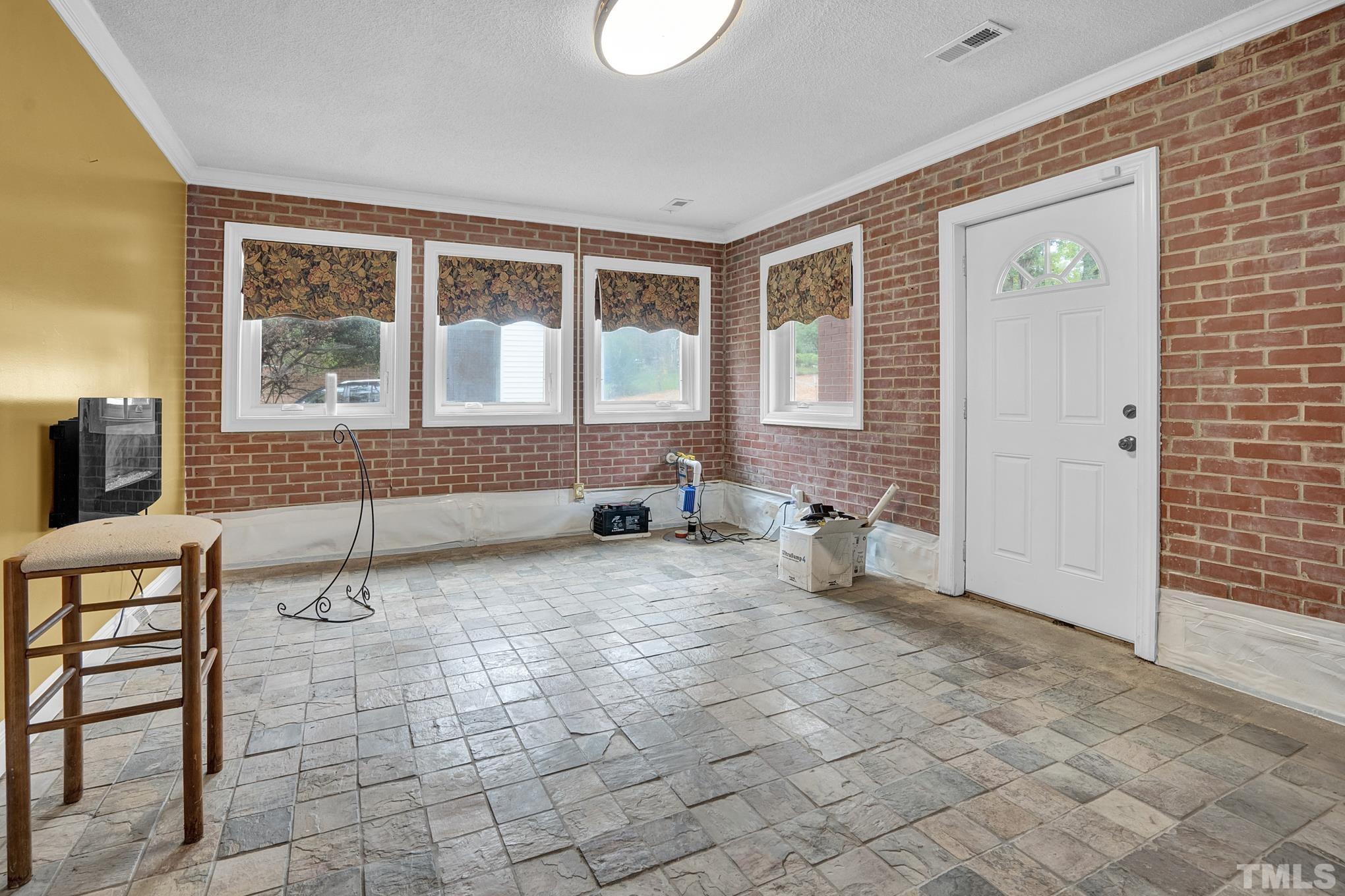 2206 Lyndhurst Drive Raleigh, NC 27610 - Photo 15 of 17 a room with furniture and window
