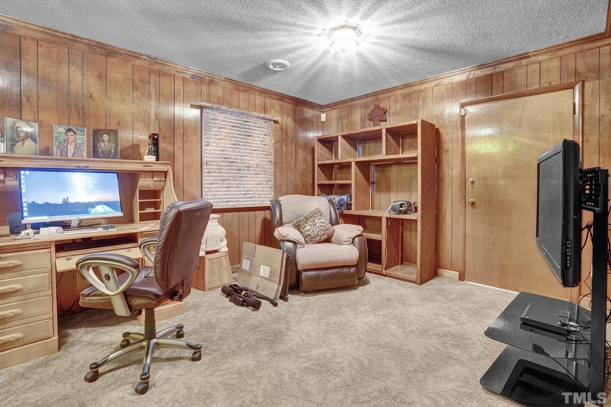 2206 Lyndhurst Drive Raleigh, NC 27610 - Photo 17 of 17 a view of a livingroom with furniture and a flat screen tv