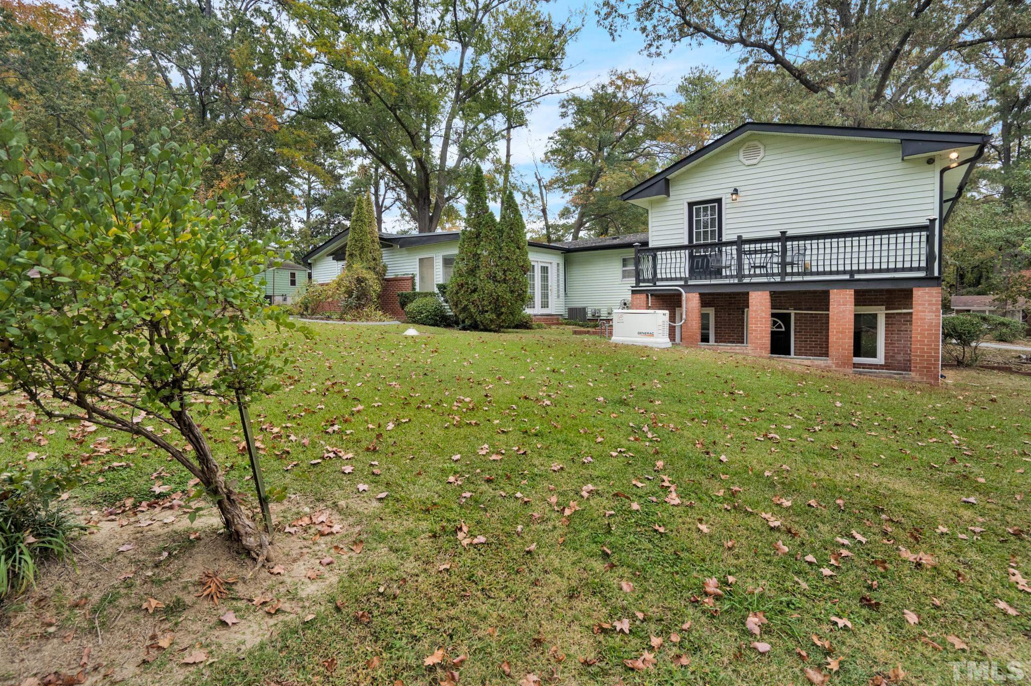 2206 Lyndhurst Drive Raleigh, NC 27610 - Photo 2 of 17 a view of a house with a yard