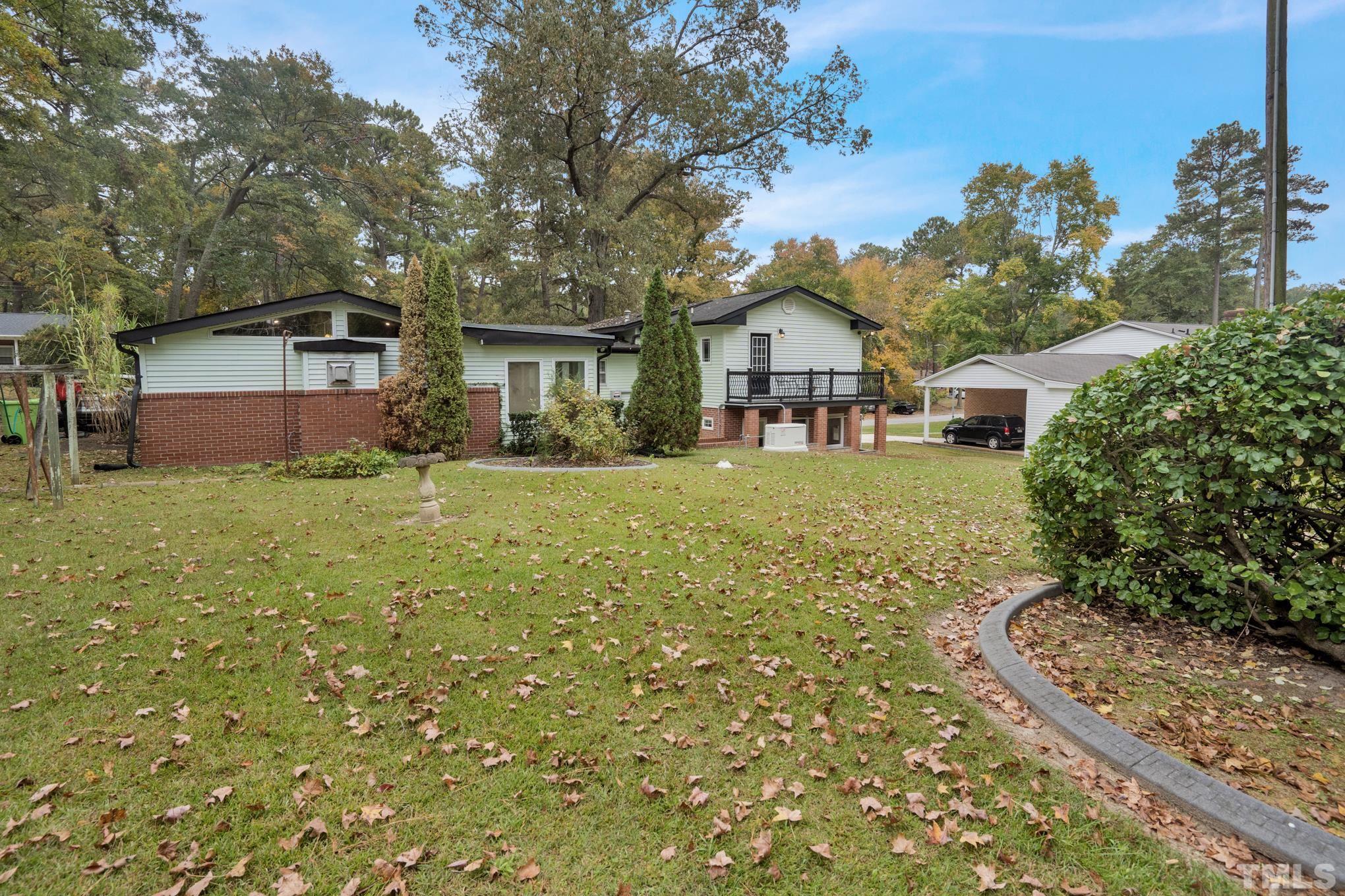 2206 Lyndhurst Drive Raleigh, NC 27610 - Photo 4 of 17 a view of a yard in front of house