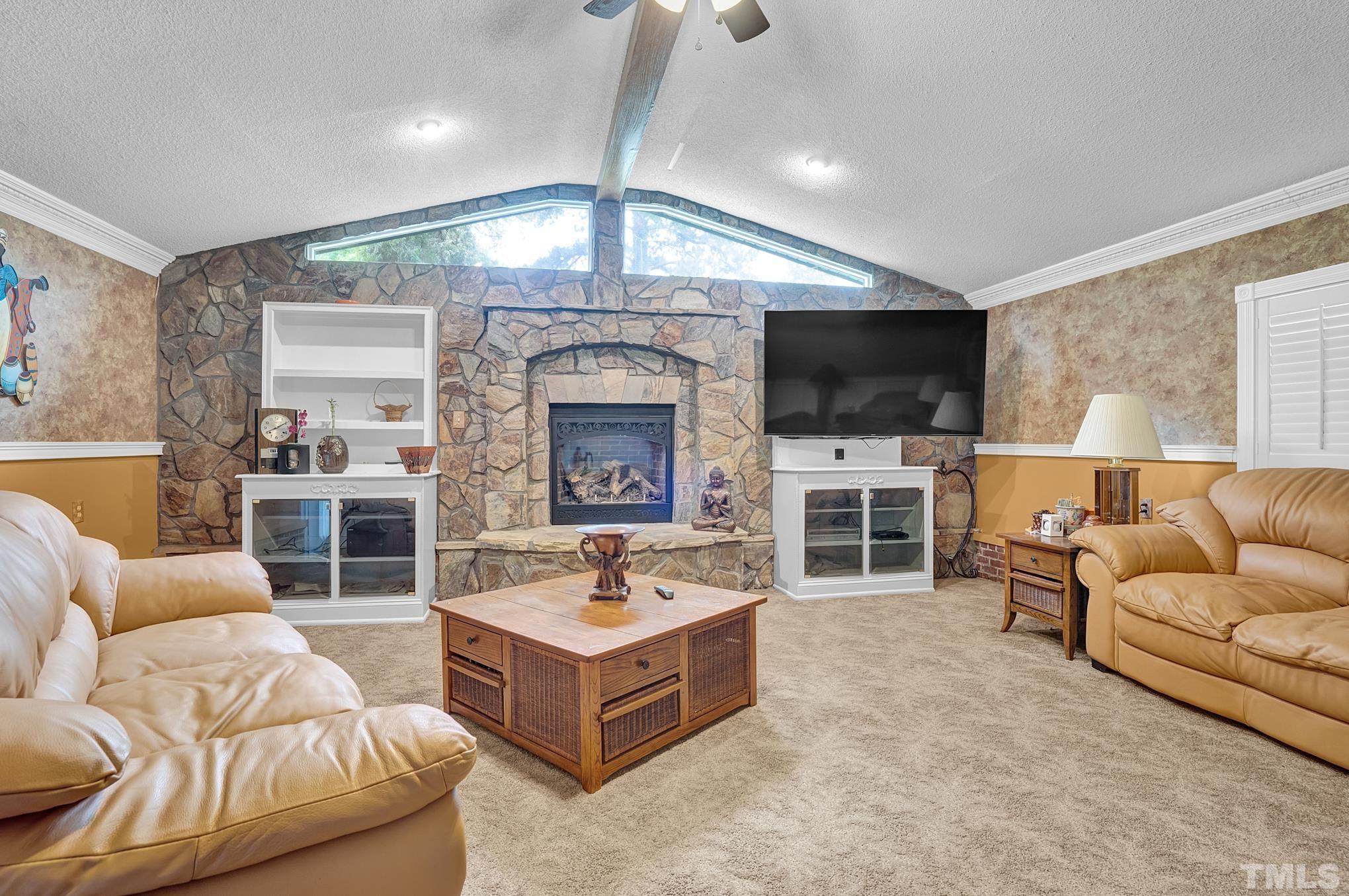 2206 Lyndhurst Drive Raleigh, NC 27610 - Photo 5 of 17 a living room with furniture and a flat screen tv