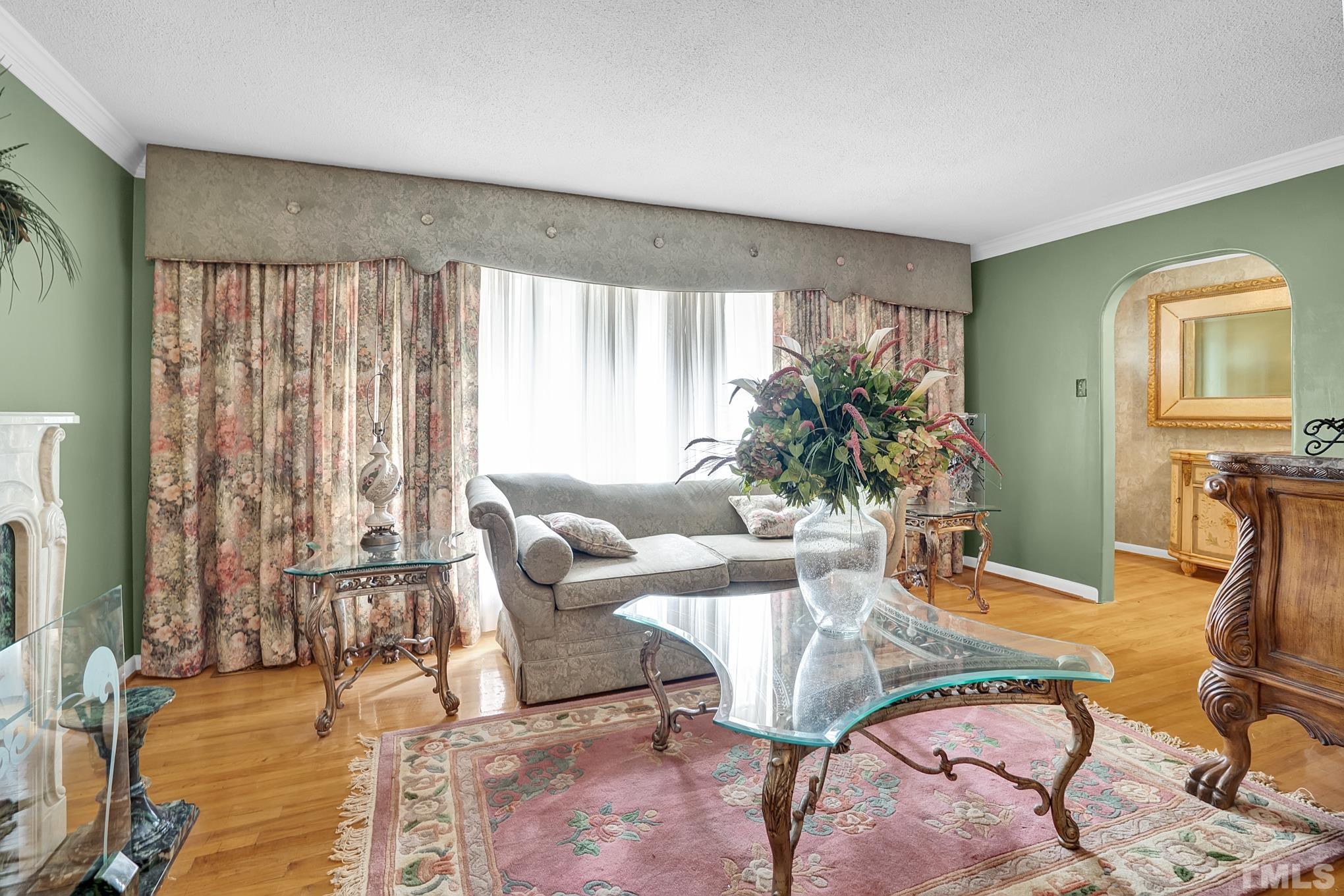 2206 Lyndhurst Drive Raleigh, NC 27610 - Photo 6 of 17 a living room with furniture and a large window
