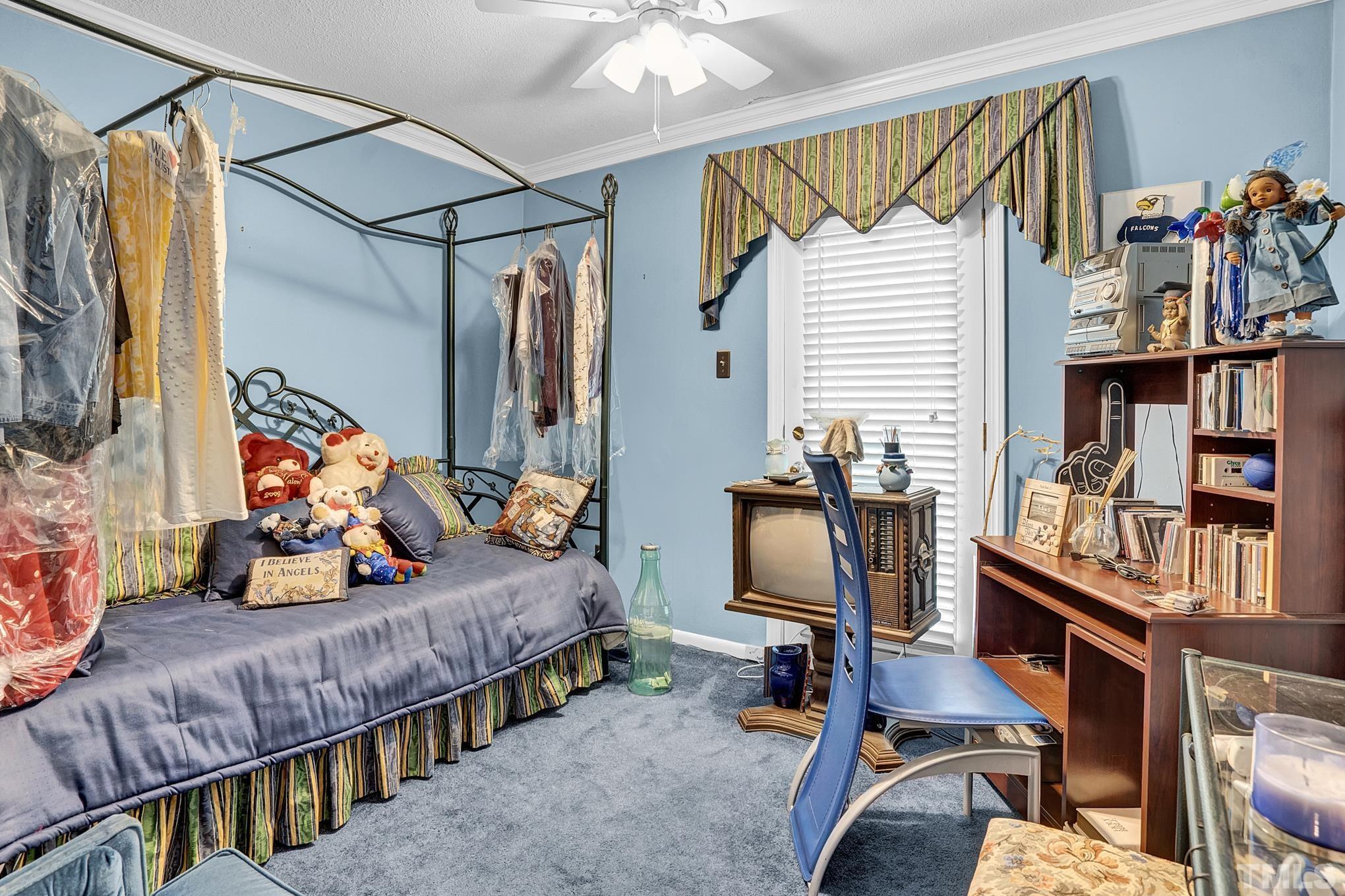 2206 Lyndhurst Drive Raleigh, NC 27610 - Photo 9 of 17 a bedroom with two beds and a window