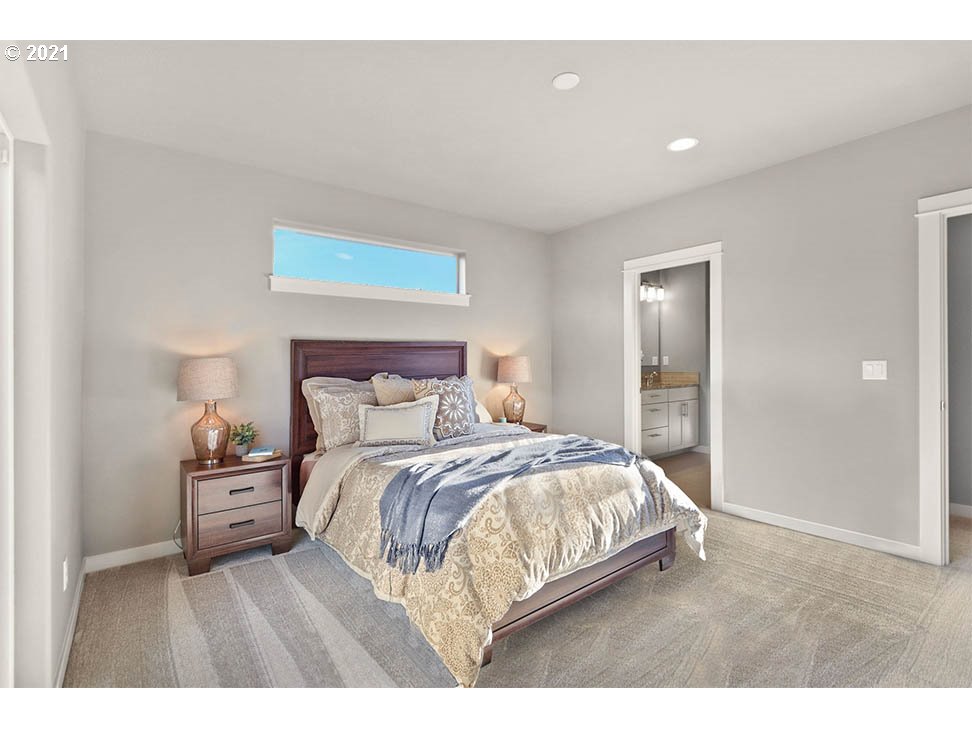 5266 Squirrel Street Springfield, OR 97478 - Photo 11 of 15 a bedroom with a bed and a night stand