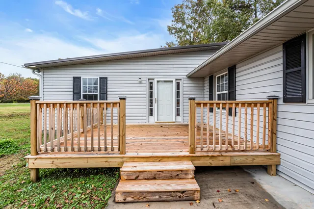 a view of a small house with a roof deck