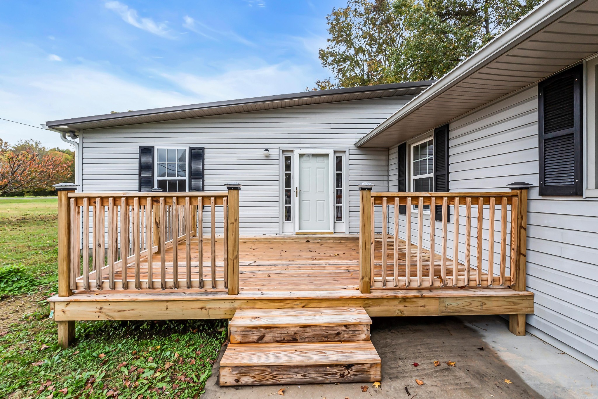 a view of a small house with a roof deck