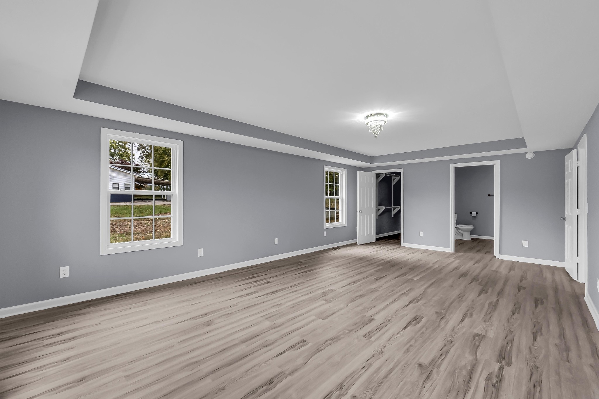 99 Anthony Mill Road Tullahoma, TN 37388 - Photo 16 of 37 a view of an empty room with wooden floor and a window