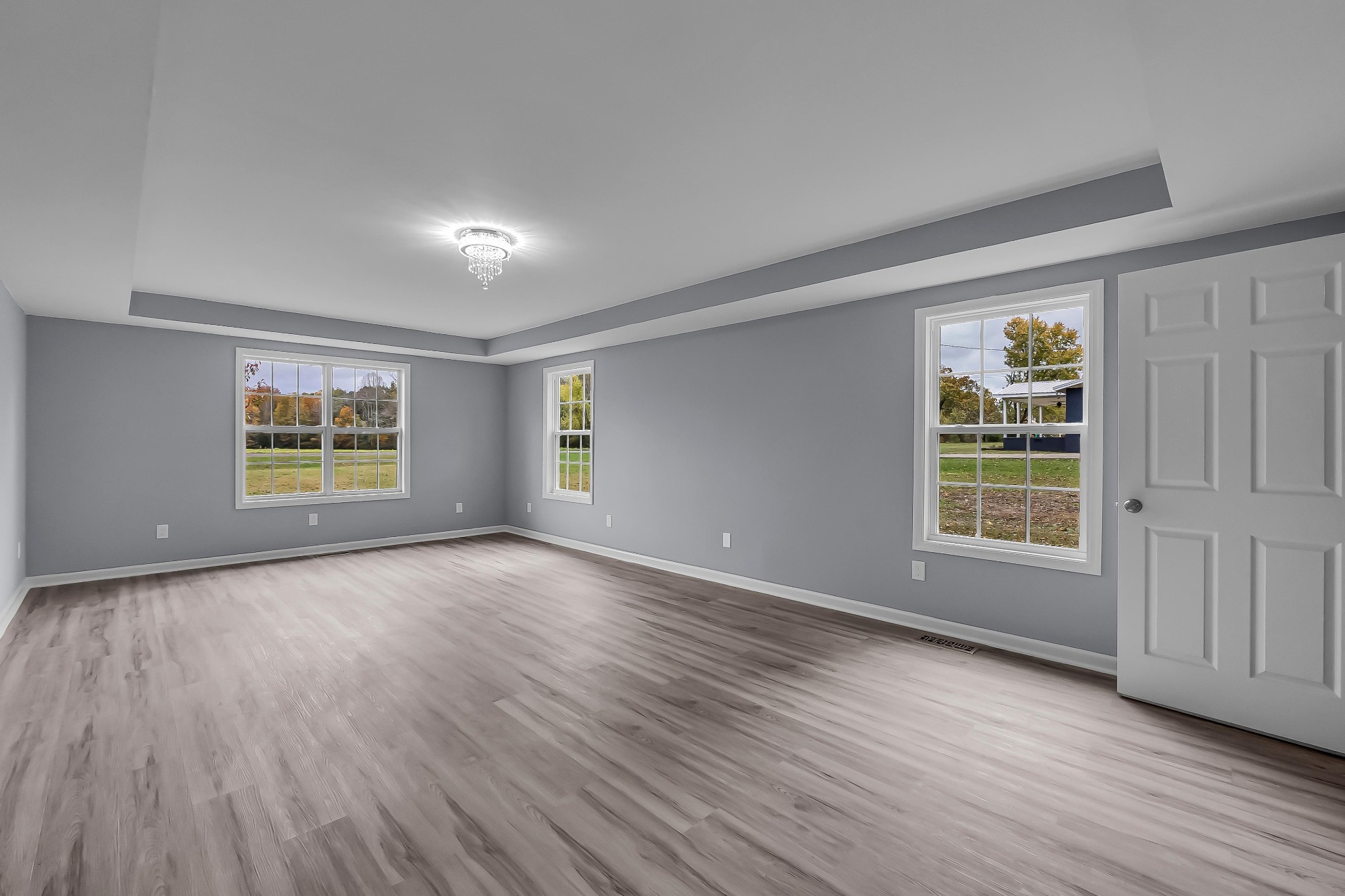 99 Anthony Mill Road Tullahoma, TN 37388 - Photo 17 of 37 an empty room with wooden floor and windows
