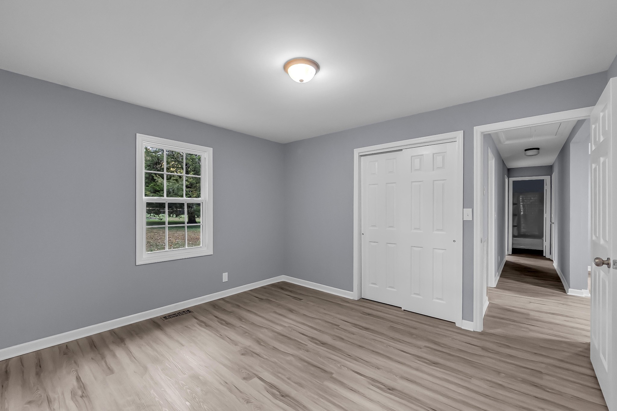 99 Anthony Mill Road Tullahoma, TN 37388 - Photo 24 of 37 an empty room with wooden floor and windows