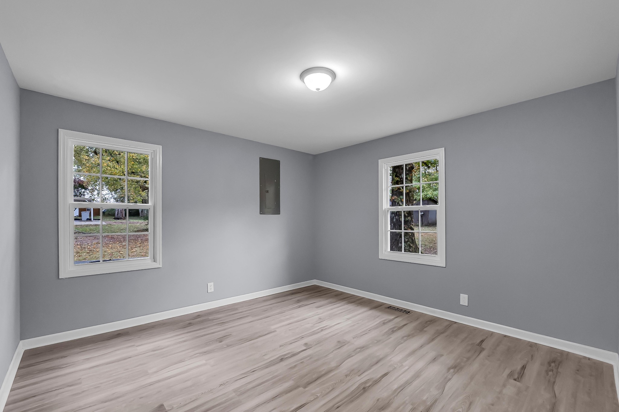 99 Anthony Mill Road Tullahoma, TN 37388 - Photo 25 of 37 a view of an empty room with wooden floor and a window