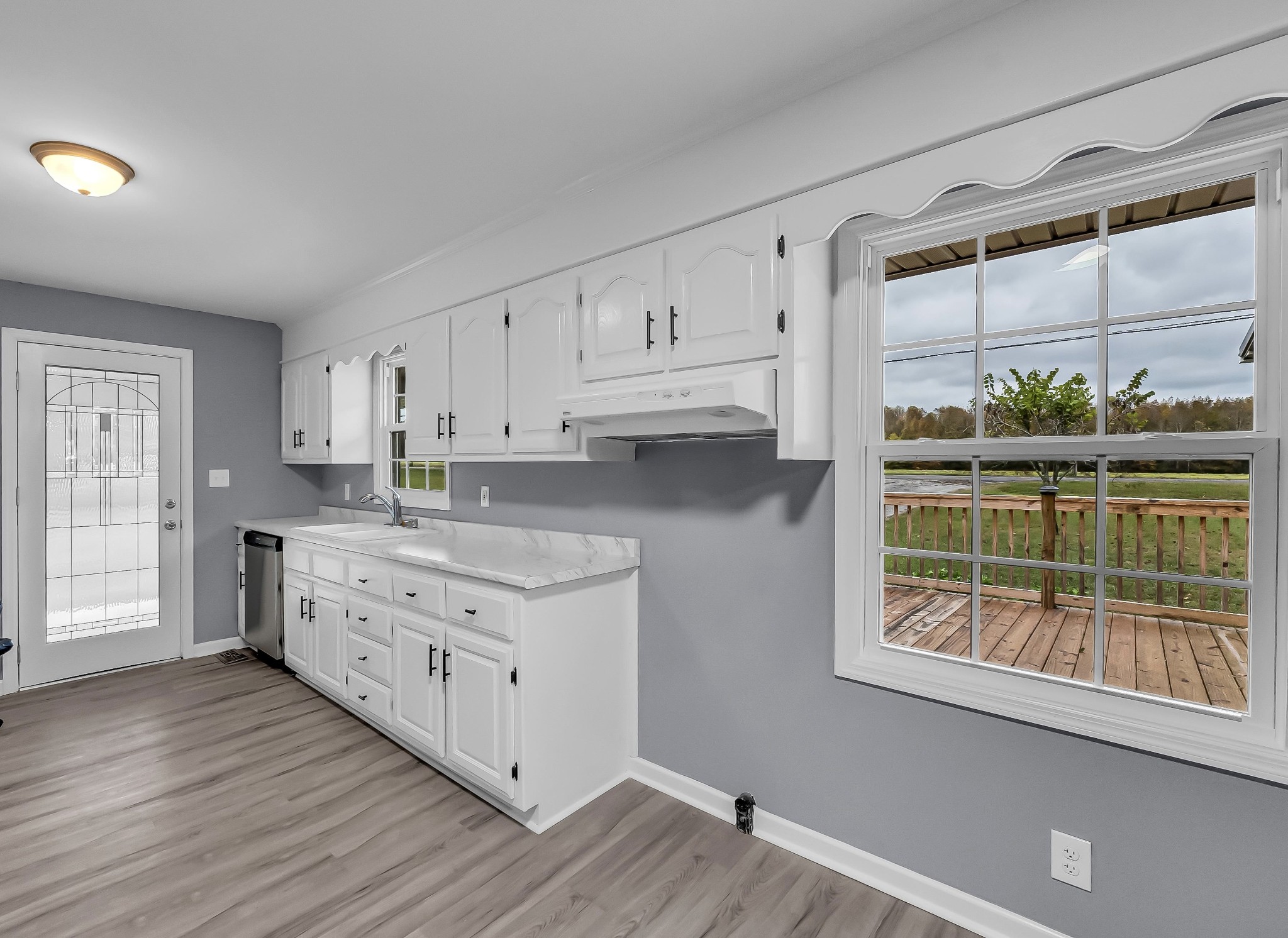 99 Anthony Mill Road Tullahoma, TN 37388 - Photo 28 of 37 a kitchen with stainless steel appliances granite countertop a stove a sink and a refrigerator