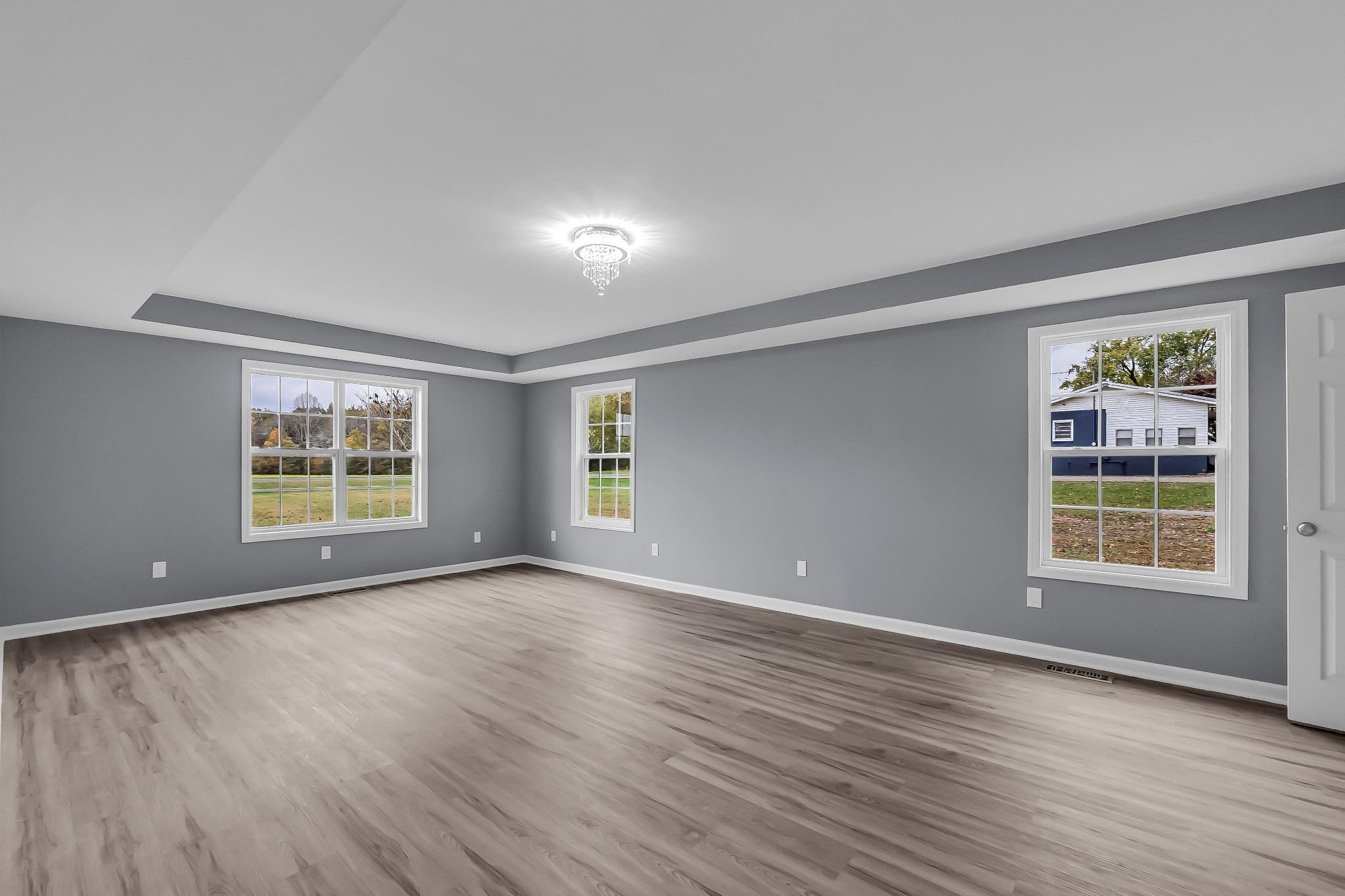 99 Anthony Mill Road Tullahoma, TN 37388 - Photo 29 of 37 an empty room with wooden floor and windows