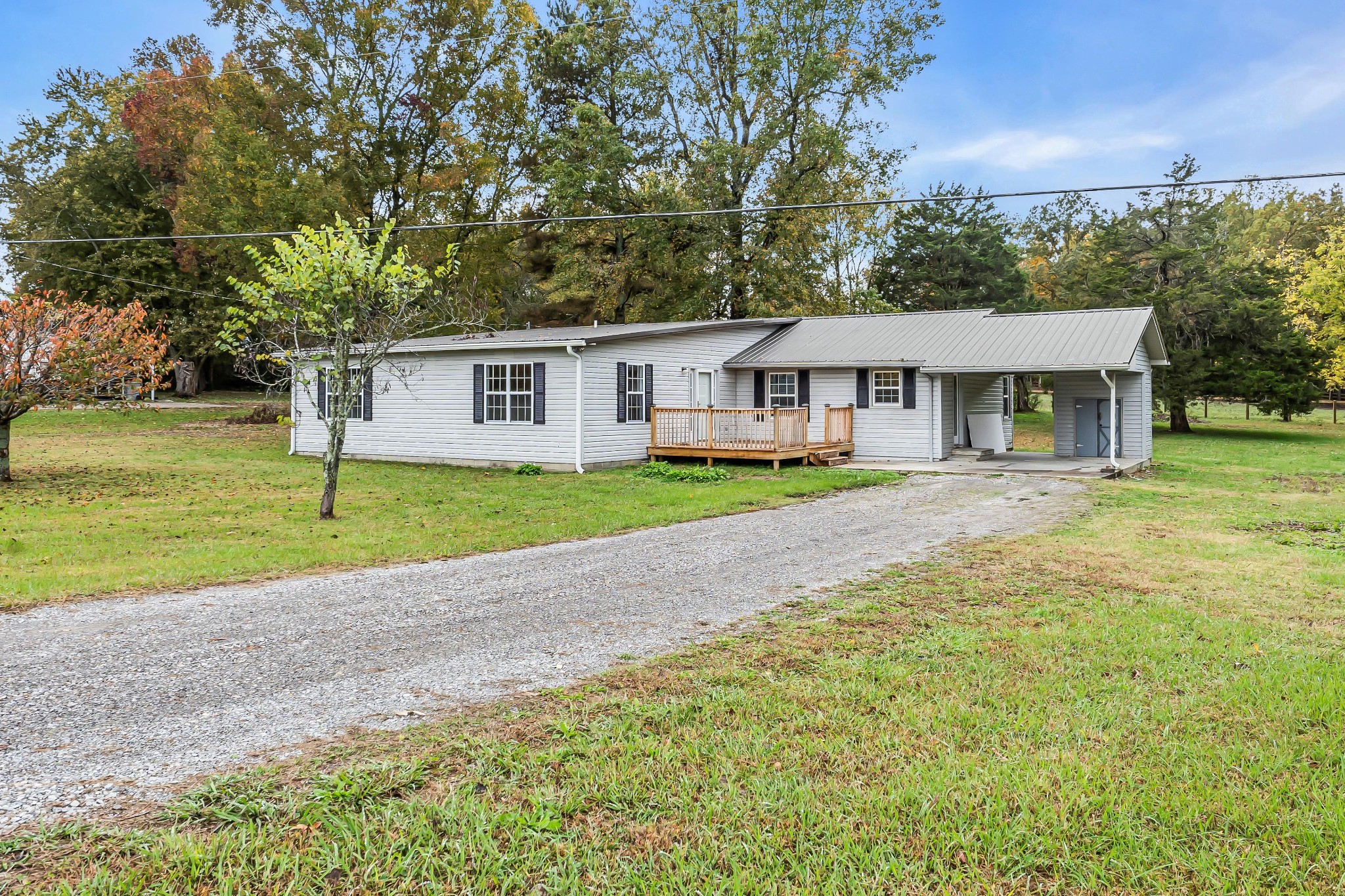 99 Anthony Mill Road Tullahoma, TN 37388 - Photo 30 of 37 a front view of a house with a yard and trees