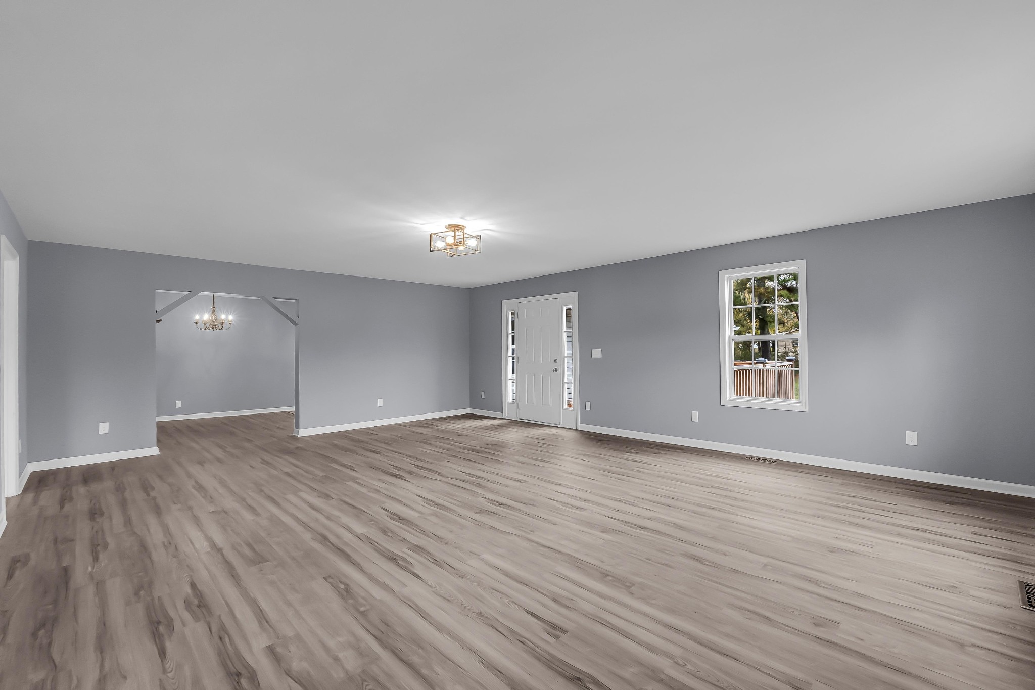 99 Anthony Mill Road Tullahoma, TN 37388 - Photo 6 of 37 a view of an empty room with wooden floor and a window