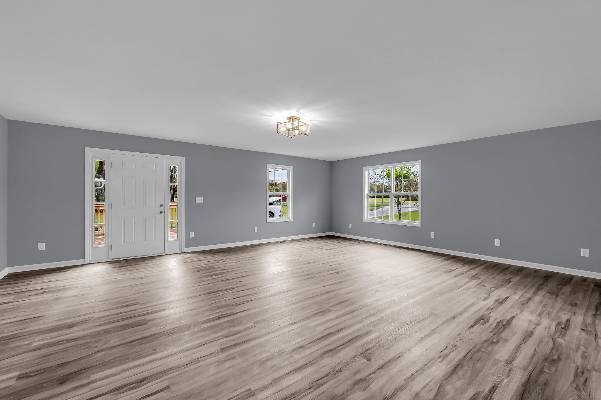 99 Anthony Mill Road Tullahoma, TN 37388 - Photo 7 of 37 an empty room with wooden floor and windows
