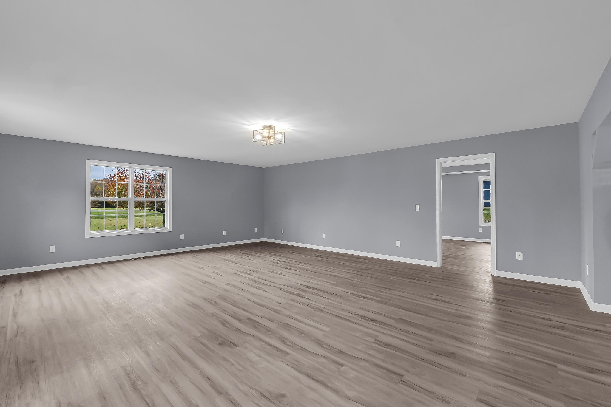 99 Anthony Mill Road Tullahoma, TN 37388 - Photo 8 of 37 a view of empty room with wooden floor and window
