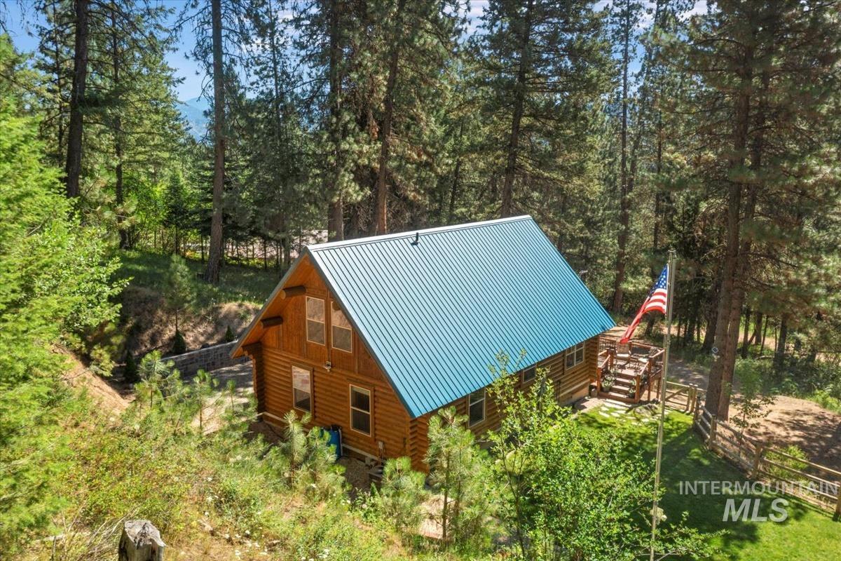 10 Elk Point Road Garden Valley, ID 83622 - Photo 8 of 42 View of property exterior featuring log exterior and a standing seam roof