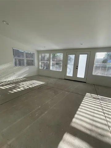 a view of empty room with windows