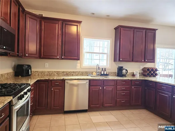 a kitchen with a cabinets and window