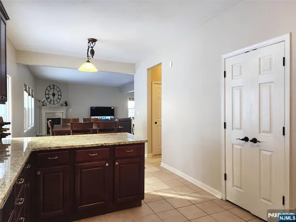 a bathroom with a granite countertop sink a mirror and vanity