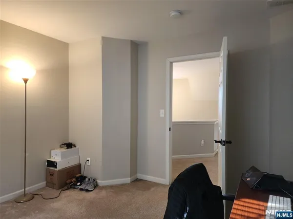 a room with a window and gym equipment