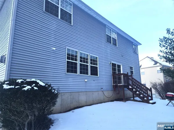 an aerial view of a house with outdoor space