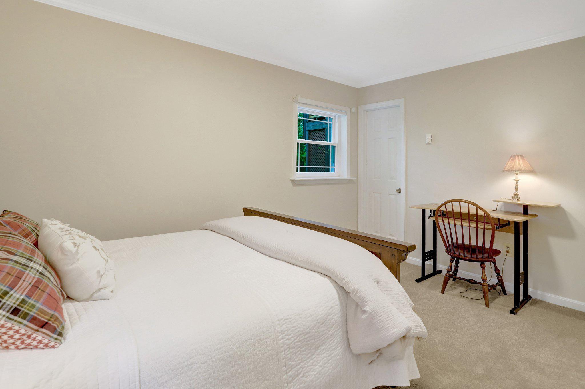 7506 Oriole Avenue Springfield, VA 22150 - Photo 42 of 67 a bedroom with a bed chair and a window