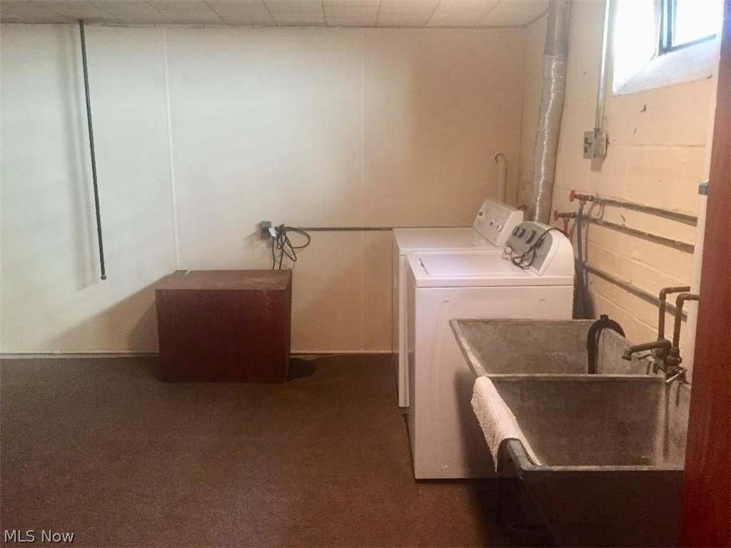 13812 Granger Road Cleveland, OH 44125 - Photo 12 of 29 This large laundry space (approx. 13x13) shows a water-proofed wall w/covered sump-pump, and a washer, dryer and double sanitary tub to meet your laundry needs.