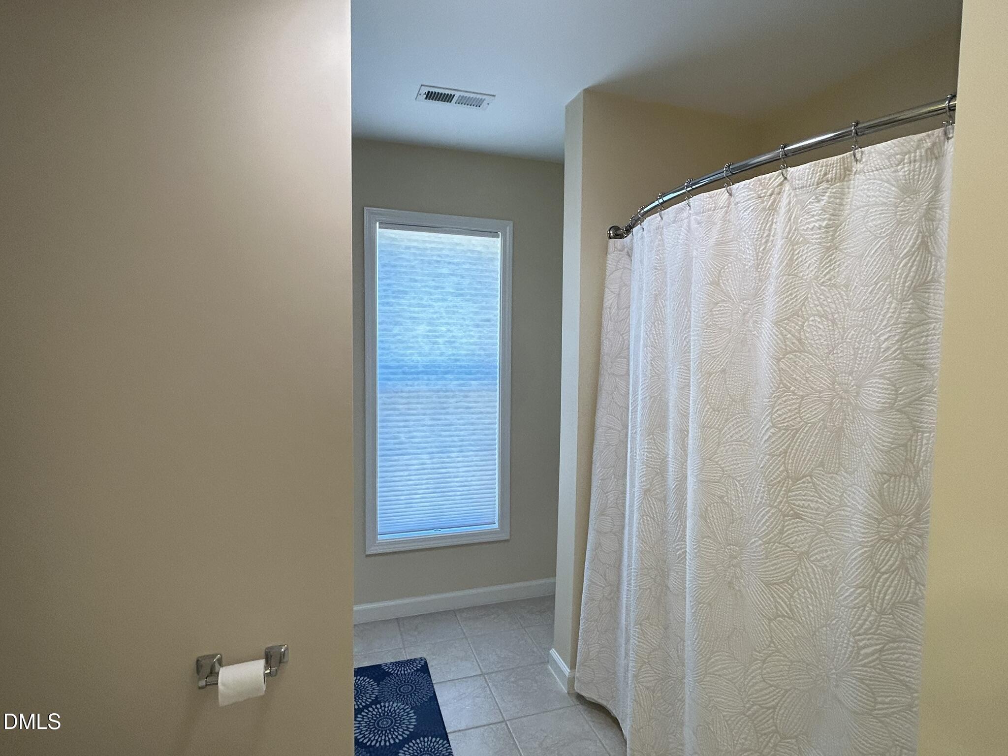 2510 Friedland Place, Unit 102 Raleigh, NC 27617 - Photo 39 of 42 a bathroom with a shower and a window