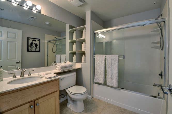 1310 Saddle Rack Street, Unit 432 San Jose, CA 95126 - Photo 7 of 10 a bathroom with a granite countertop sink toilet and shower